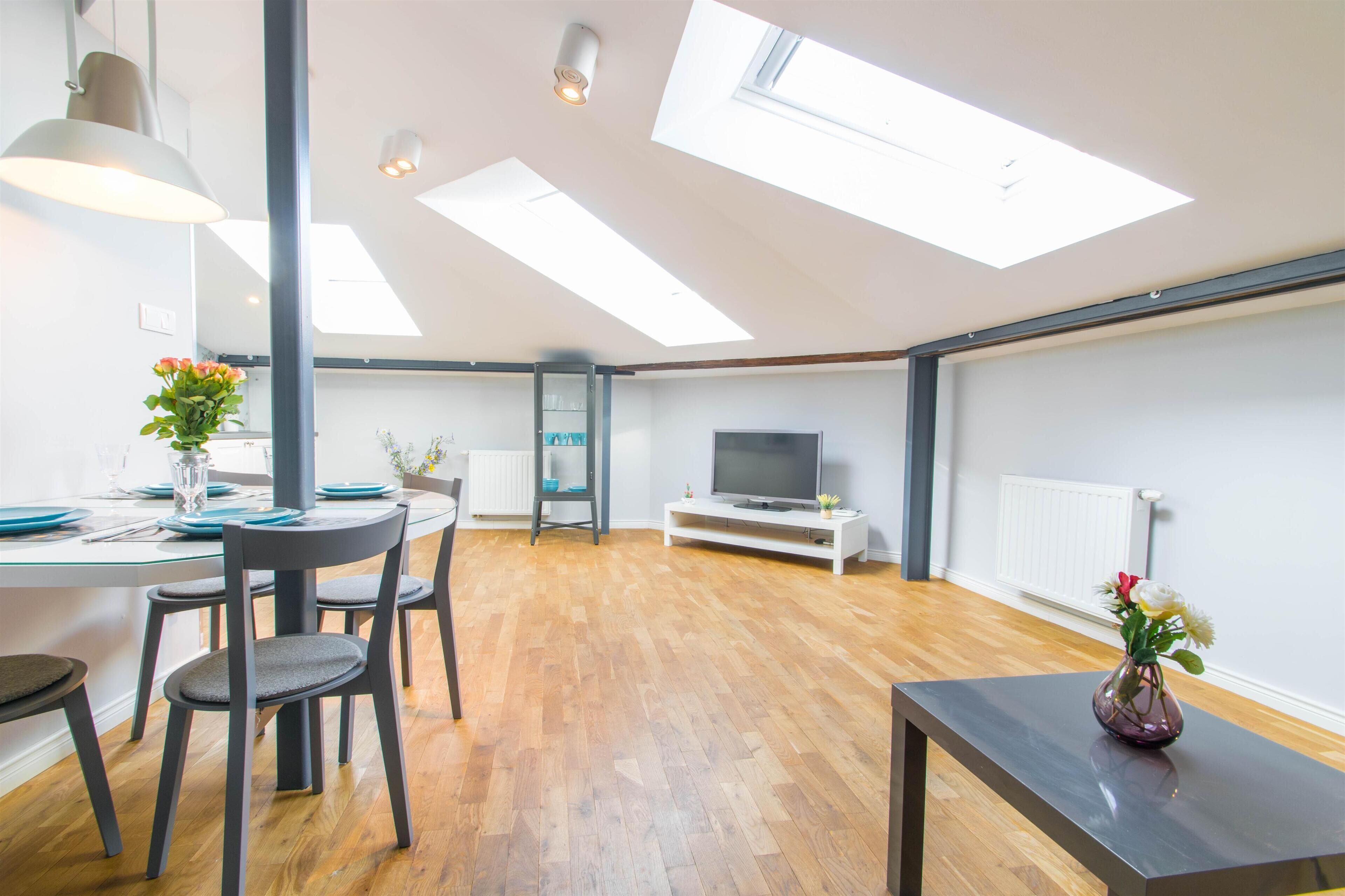 1 Bedroom Apartment by the Main Square | AC | Living room | 37-inch flat-screen TV with cable channels