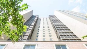 The entrance of a building with the number 300 and the name "PEACHTREE TOURS" above the entrance. - FIFA 2026 Walk to Stadium | 1BR Unit 8K ATL (Atlanta)