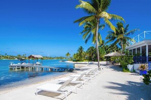 On the beach, sun loungers, beach towels