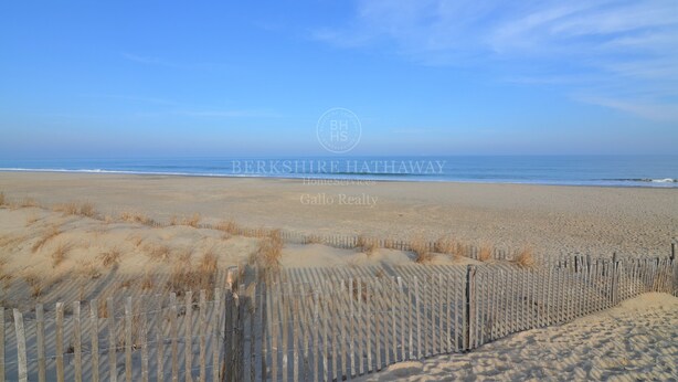 A beach with a wooden fence and a clear blue sky. - 24 Dickinson Avenue, 8A Dewey Villas, Dewey Beach, Delaware (Dewey Beach)
