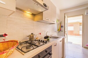 Standard Apartment, Multiple Bedrooms (Casa Lory 3 Cozy and near the Sea) | Private kitchen | Fridge, oven, stovetop, cookware/dishes/utensils