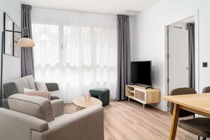 One-bedroom comfort apartment | Área de sala de estar