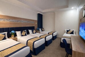 Deluxe Quadruple Room | In-room safe, desk, laptop workspace, soundproofing