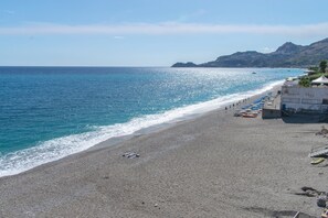 On the beach, sun loungers, beach towels