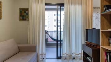 Design Apartment | Living area | 40-inch Smart TV with digital channels