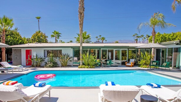 A pool area with lounge chairs and a clear blue pool. - Casa Del Sol, a private Palm Springs Oasis (Palm Springs)