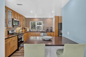 Coffee/tea maker, fridge, microwave, oven