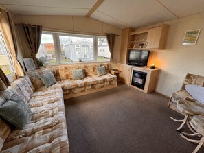 Chalet | Living area | Fireplace - 3 Bed Caravan - Sleeps 8 - Pet Friendly, Parking (Abergele)