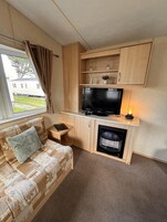 Chalet | Zona de estar | Una chimenea