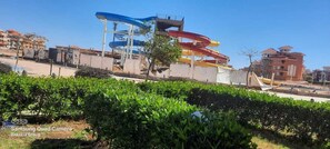A water park with multiple slides and a clear sky. - Porto sharm elsheikh  (Sharm El Sheikh)