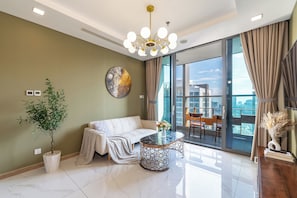 Deluxe Apartment, 2 Bedrooms, City View | Living area | 42-inch Smart TV with cable channels