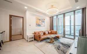 Deluxe Apartment, 3 Bedrooms, Balcony, City View | Living area | 42-inch Smart TV with cable channels - LANDMARK 81 Luxury Riverside Retreat (Ho Chi Minh City)