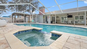 A pool area with a hot tub, covered seating, and a gazebo. - New Luxury House Pool. Just 14 Minutes From the Airport (Tampa)