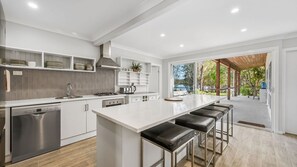 Enjoy cooking in this well-equipped kitchen with a central island and oven.