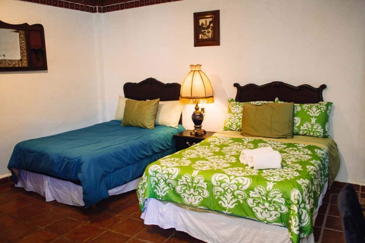 Basic Room, 2 Double Beds | Bathroom | Rainfall showerhead, towels, soap, shampoo