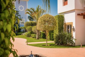 Surrounded by lush greenery, this serene building offers a tranquil retreat.