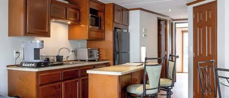 Fridge, microwave, stovetop, coffee/tea maker