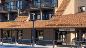 A multi-story hotel with balconies, a rental center, and a storefront named ColeSport.