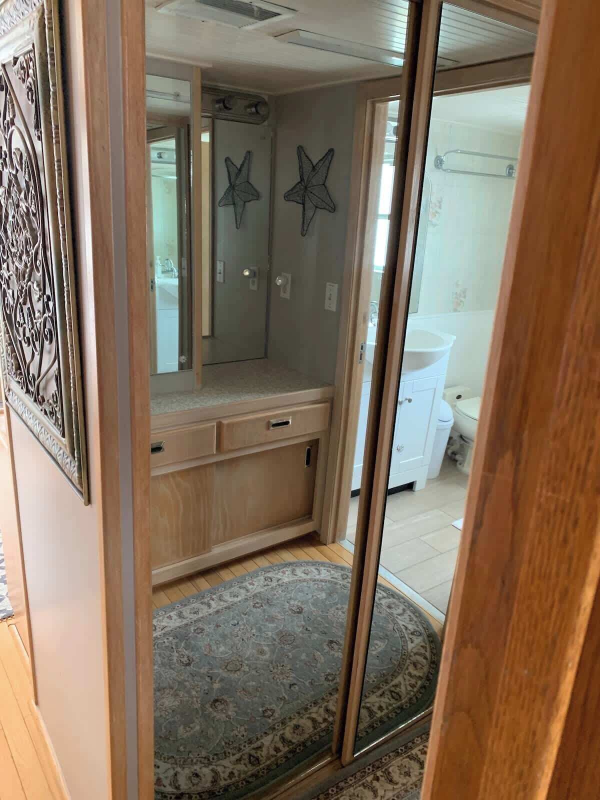 A bathroom with a shower, a sink, and a toilet.