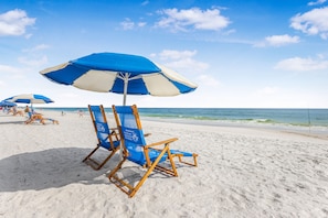 On the beach, sun-loungers