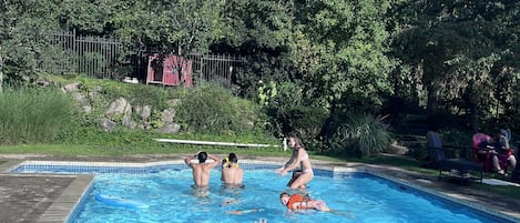 Seasonal outdoor pool, pool umbrellas, pool loungers