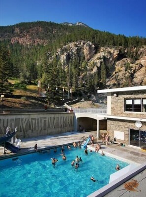 Outdoor pool, a heated pool - Fully Equipped 2BR Condo w/ Mountain Views & Pool (Radium Hot Springs)