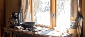 Straw clay sauna house on organic farm
