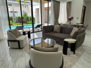 Villa Deluxe, 3 chambres, vue sur la piscine | Aire de séjour
