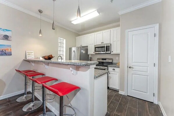 Fridge, microwave, oven, stovetop - Island Bliss Awaits: Your Boutique Condo Escape on South Padre Island (South Padre Island)