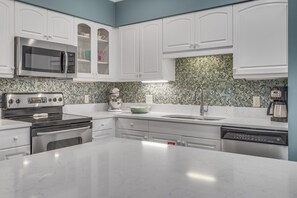 Coffee/tea maker, fridge, microwave, oven