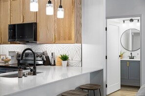 Fridge, microwave, oven, stovetop - Eastside One Condo With Rooftop (Traverse City)