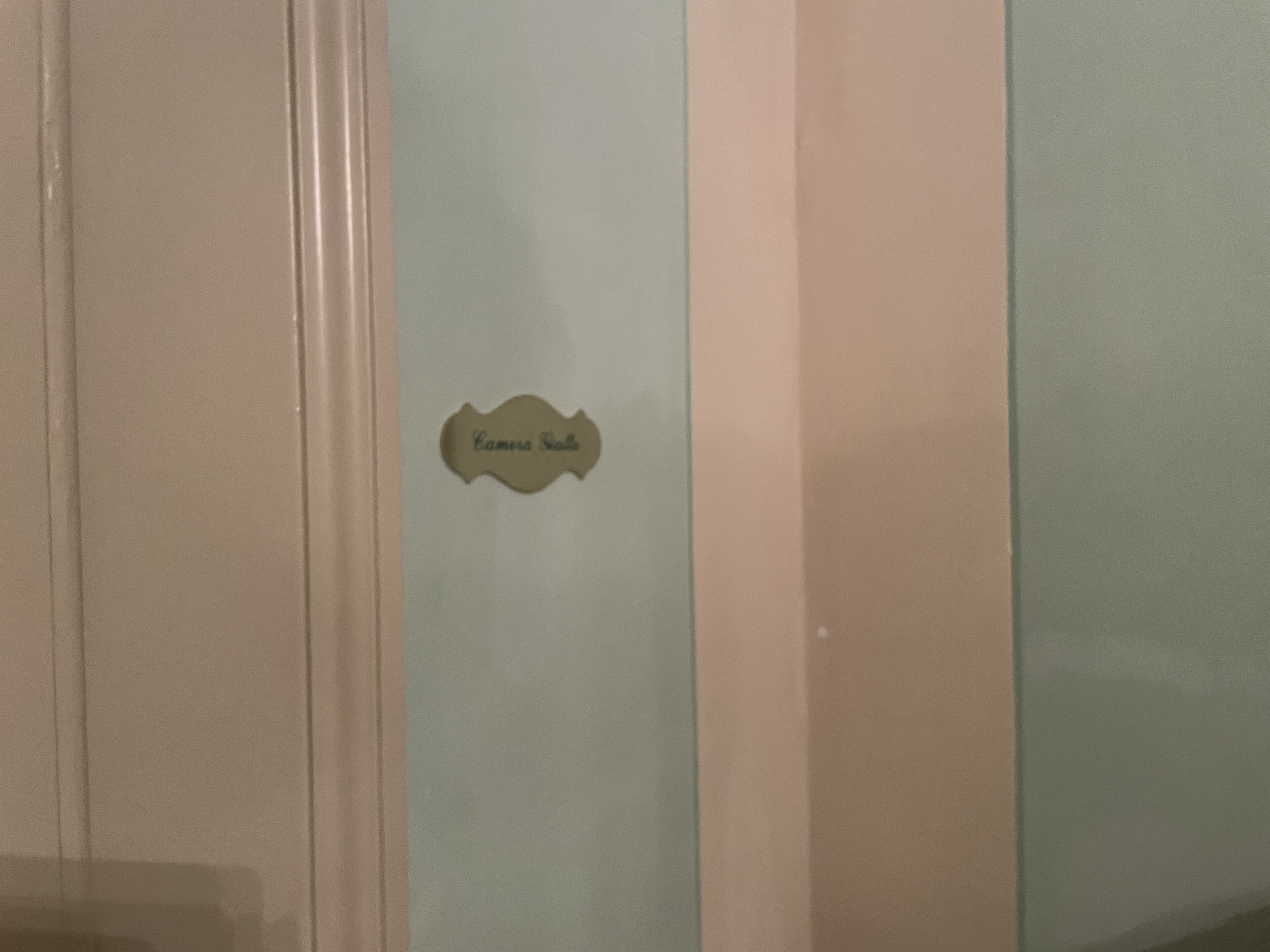 A wall with a sign that reads "Camera Room".