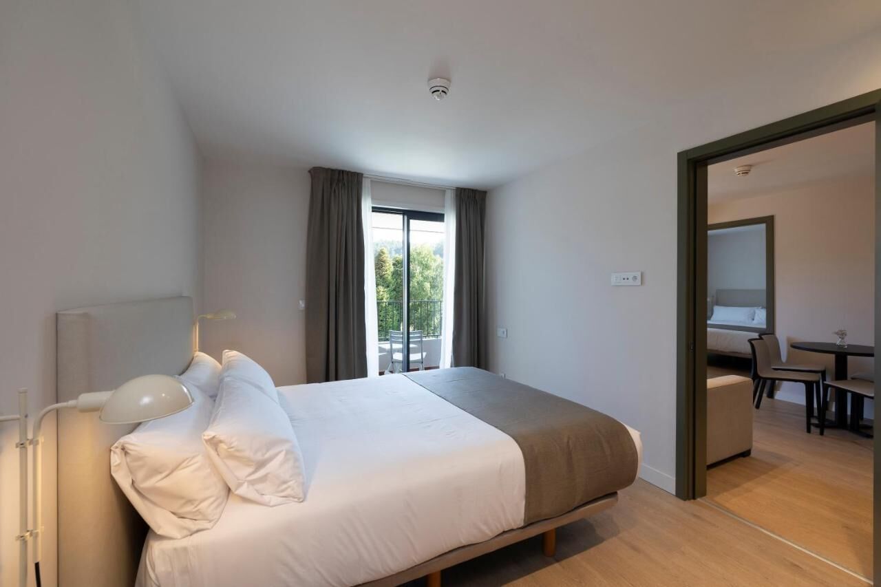 Apartment, Balcony, Pool View | Desk, laptop workspace, iron/ironing board, free WiFi