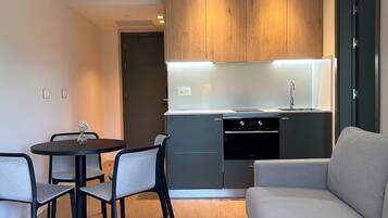 Apartment, Balcony, Pool View | Desk, laptop workspace, iron/ironing board, free WiFi