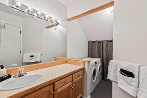 Hair dryer, towels, shampoo, toilet paper