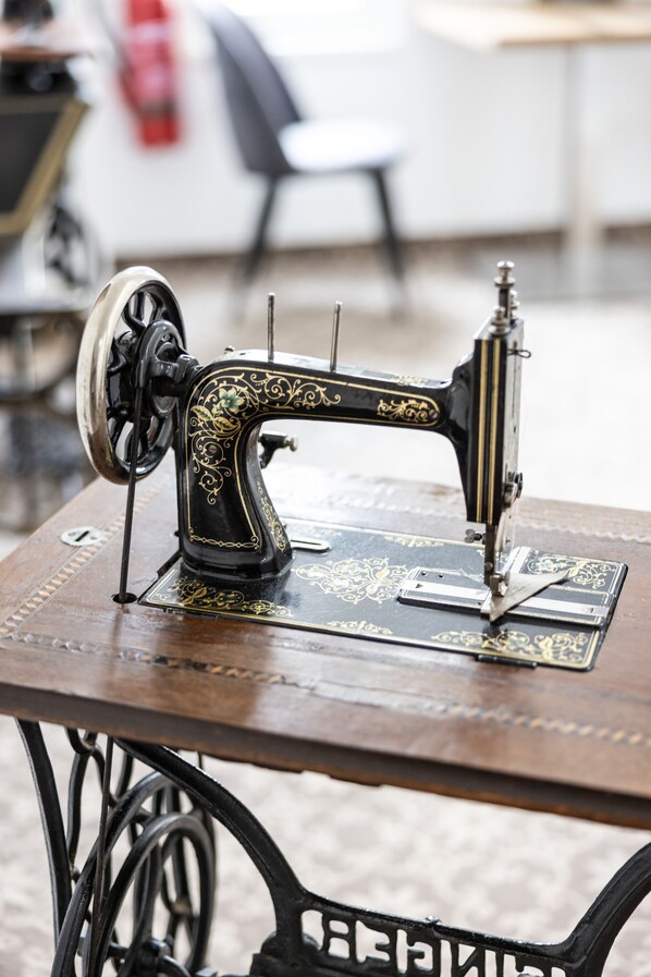 A vintage sewing machine on a wooden table.