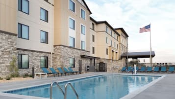 Outdoor pool, open 8:00 AM to 8:00 PM, pool umbrellas, pool loungers