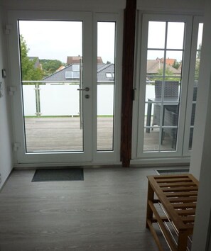 Enjoy the serene view from the deck, accessible through the sliding glass door.