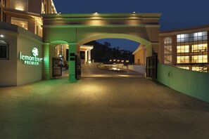 Welcome to Lemon Tree Premier, where a beautiful archway and elegant facade set the tone for a warm and inviting stay.