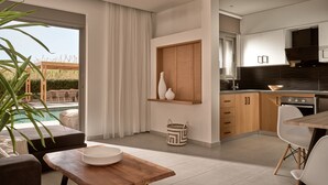 A modern kitchen with wooden cabinets, a dining area with a wooden table, and a view of an outdoor pool area.
