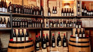 A wine cellar with wooden shelves and barrels labeled 'MASI'. - Hotel la Pietra Restaurant (Fosdinovo)