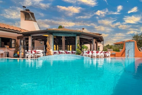 Seasonal outdoor pool, open 10:30 AM to 6:00 PM, pool loungers