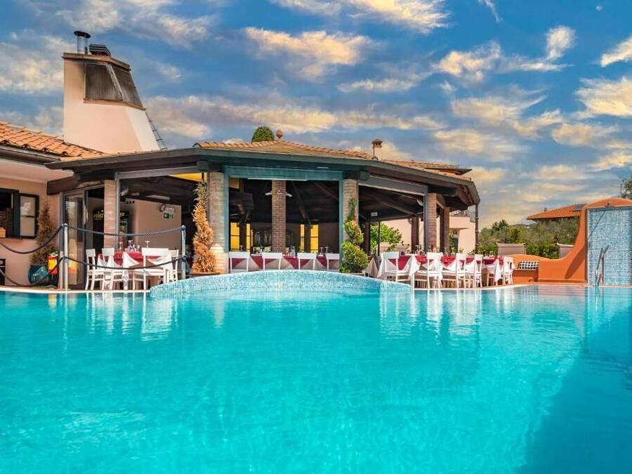 Seasonal outdoor pool, open 10:30 AM to 6:00 PM, pool loungers