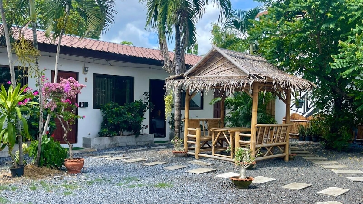 Tropical outdoor area at New Breakers Hotel Rawai
