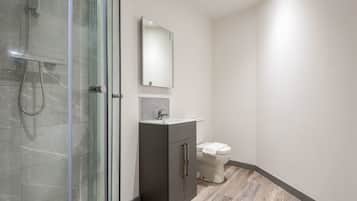 Shower, hair dryer, towels, shampoo