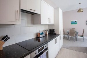 Coffee/tea maker, fridge, microwave, oven