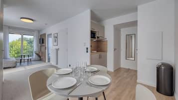Family Studio | Living area | 80-cm flat-screen TV with digital channels, offices
