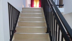 A staircase with beige steps and black railings. - Villa in Yakkala, Gampaha (Yakkala)