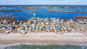 An aerial view of a coastal residential area with houses, a beach, and a body of water. - Waterfront Coastal Retreat w/ Pool | Sunset Views! (North Topsail Beach)