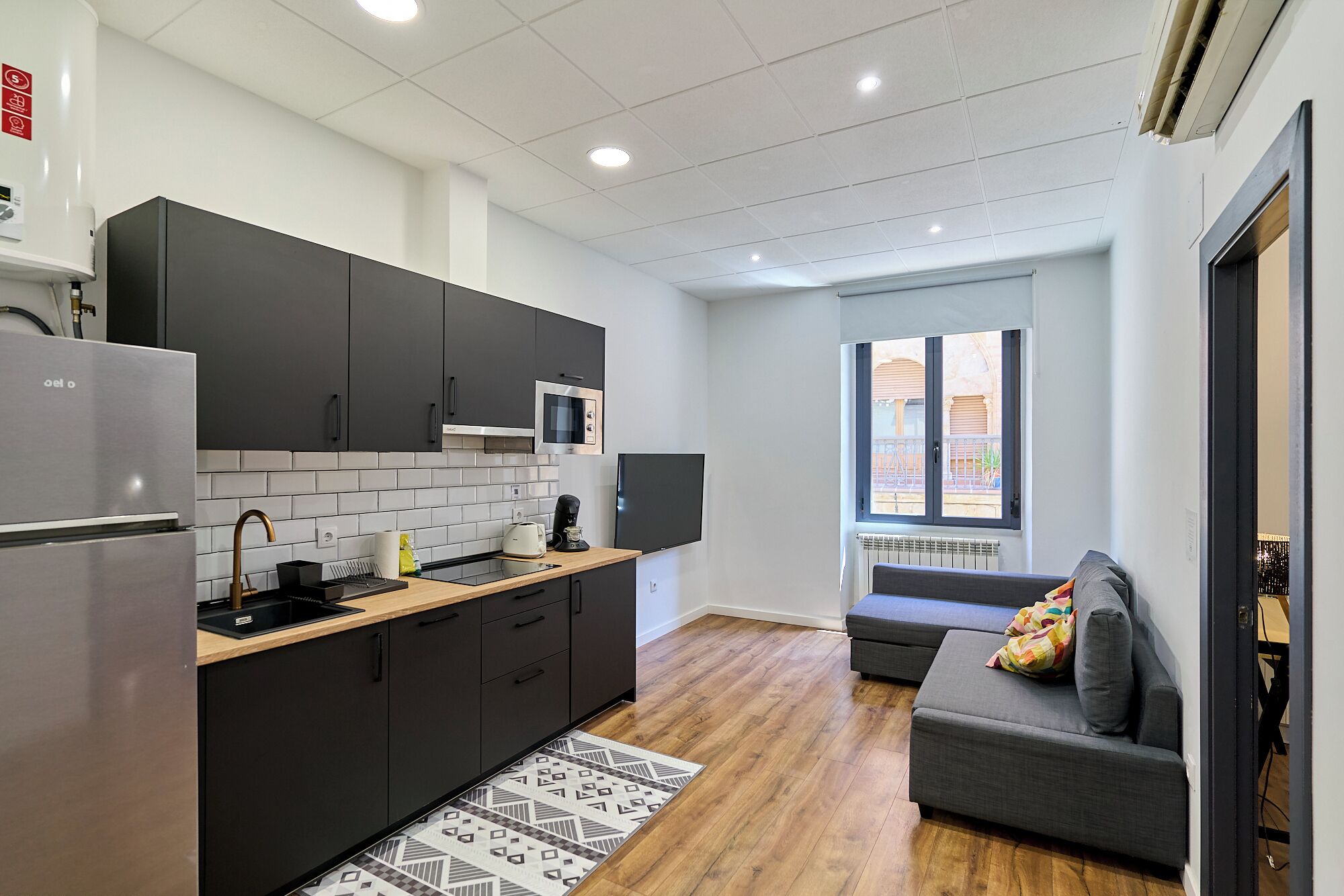 Deluxe Apartment | Living area | 32-inch Smart TV with digital channels